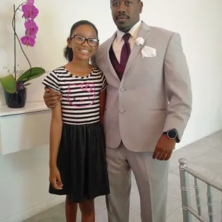 Father and daughter, Derrick and Zara, pose for picture